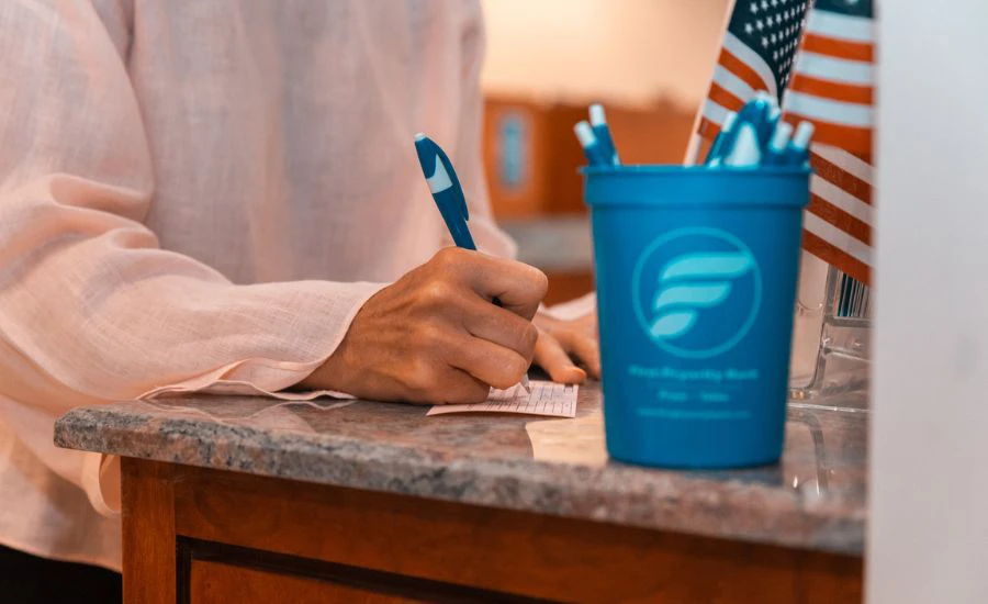 Customer at Pryority Bank learning about certificates of deposit