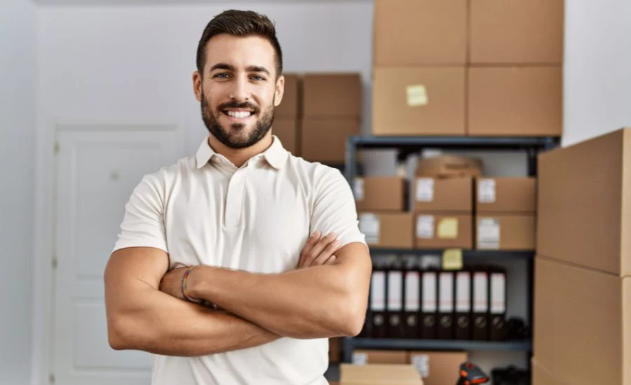 Businessman standing in inventory room