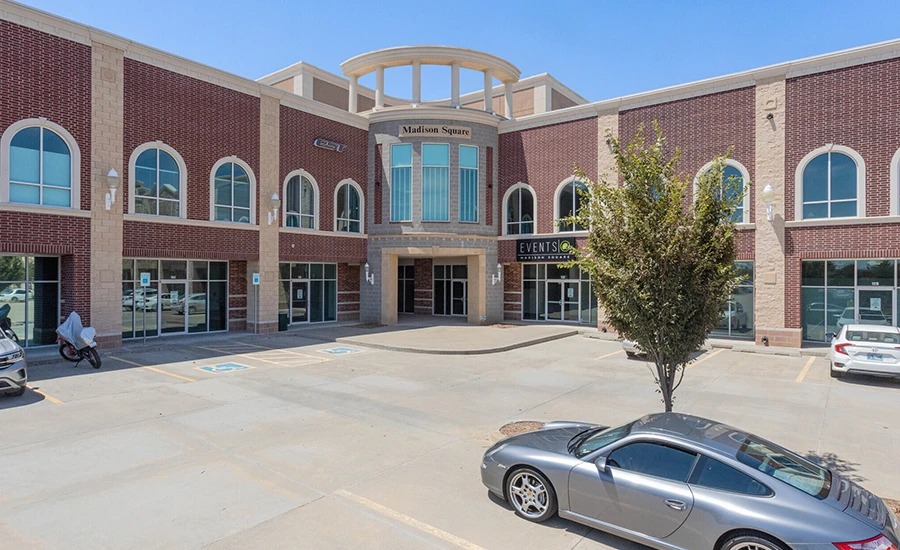 close of of corner brick building in shopping center